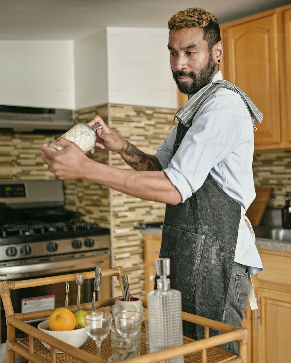 a man standing in a kitchen preparing food