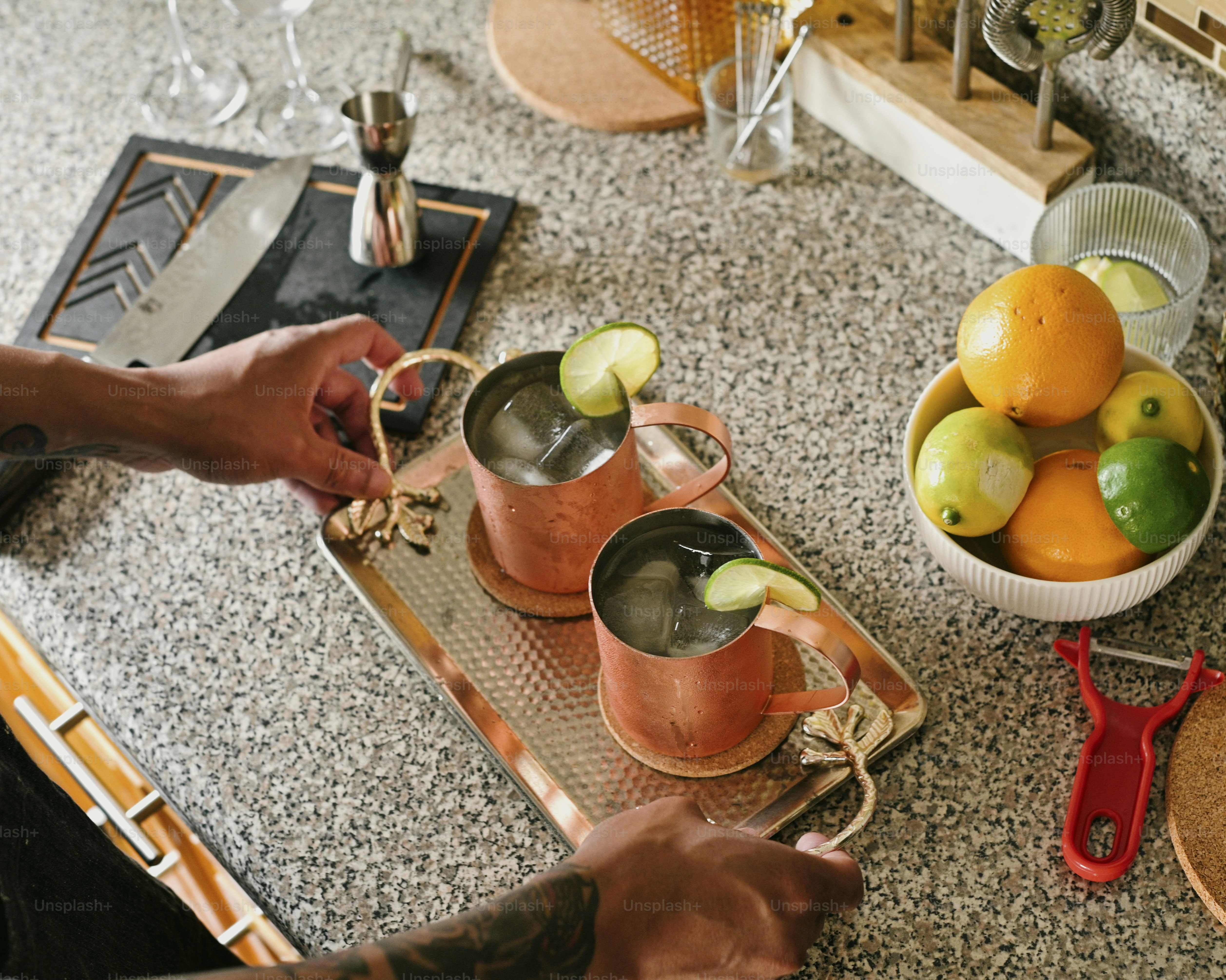 a person is making a drink at a counter
