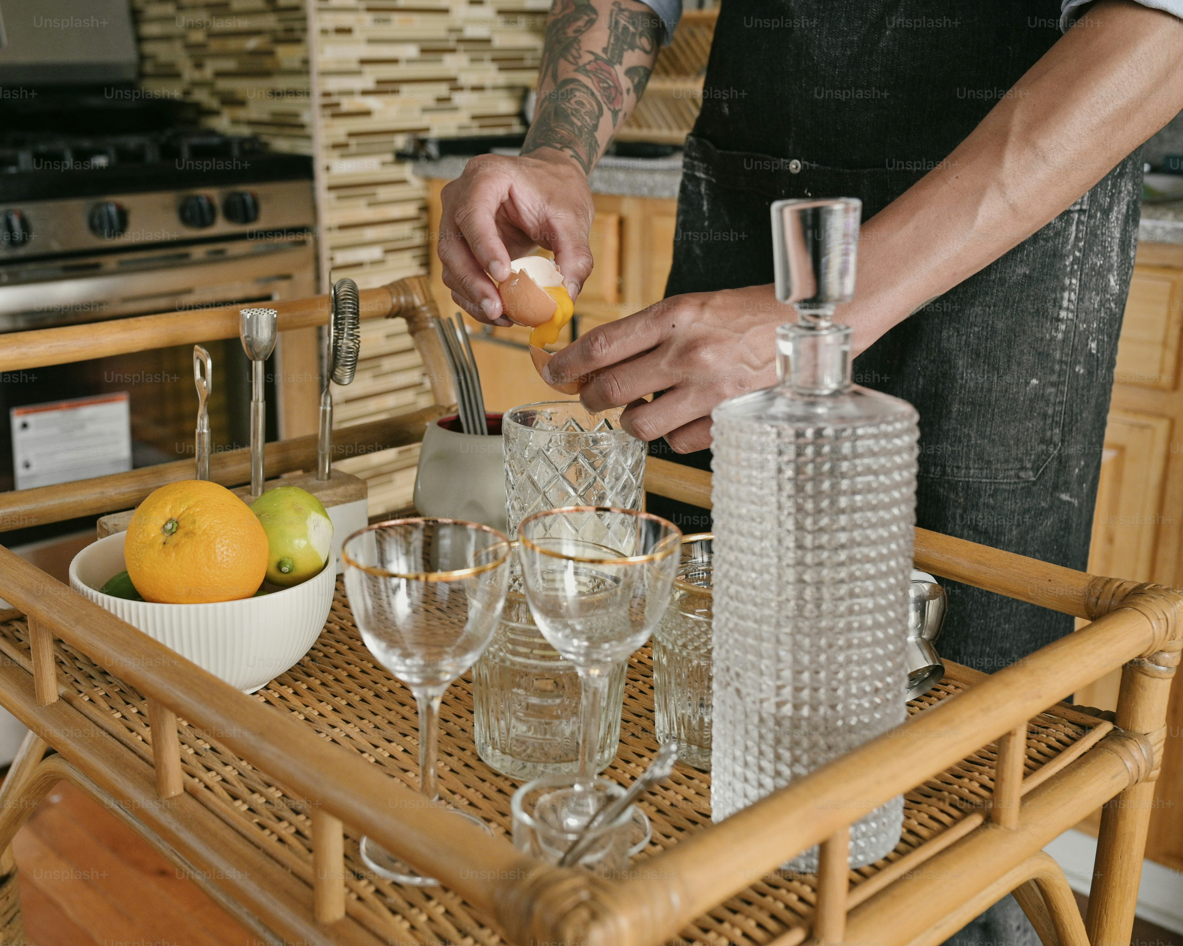 a man in a kitchen preparing food on a tray