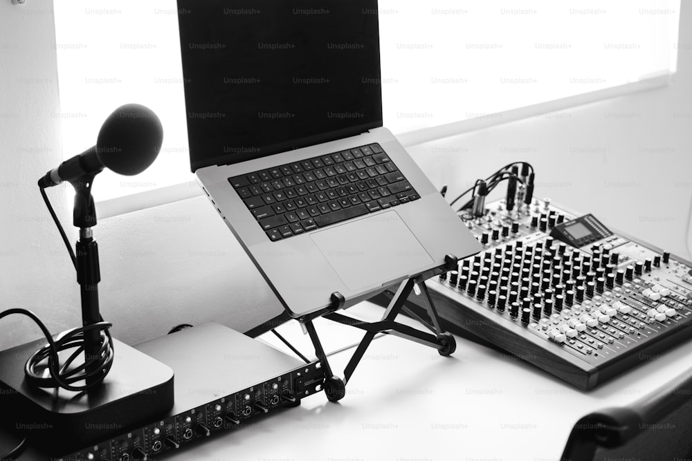 a laptop computer sitting on top of a desk