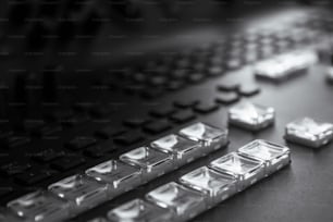 a black and white photo of a keyboard and keys
