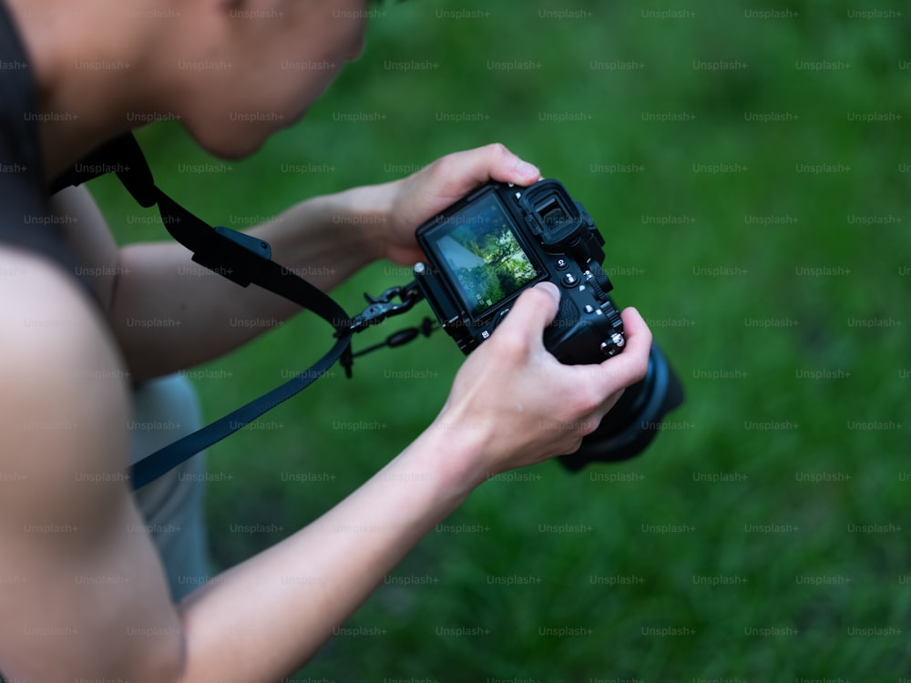 a person holding a camera in their hands