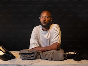 a man sitting in front of a laptop computer