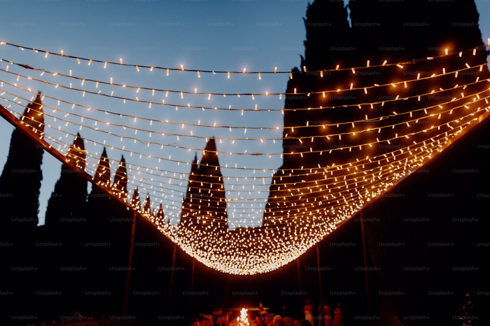 a string of lights hanging from the side of a building