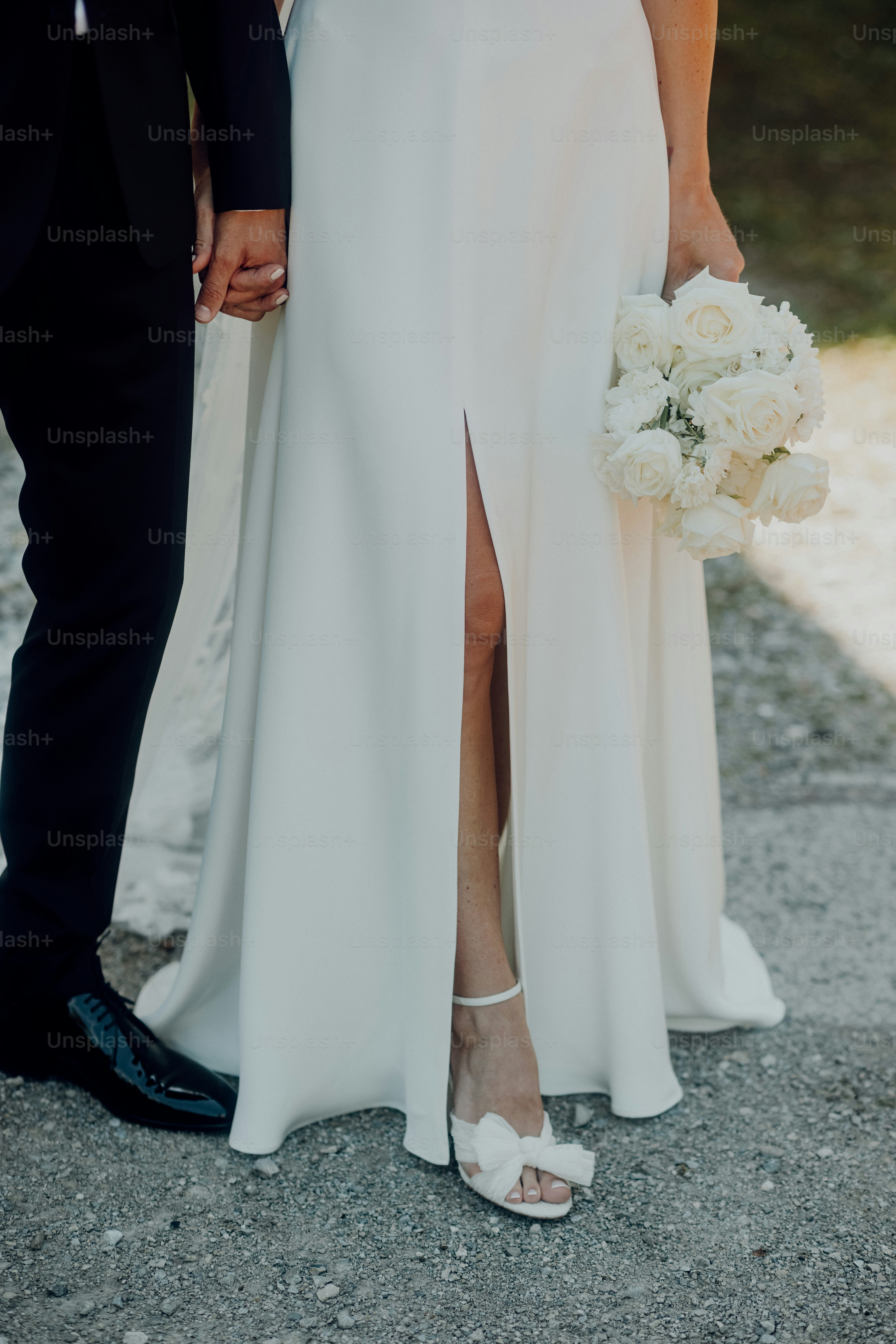 a bride and groom standing next to each other