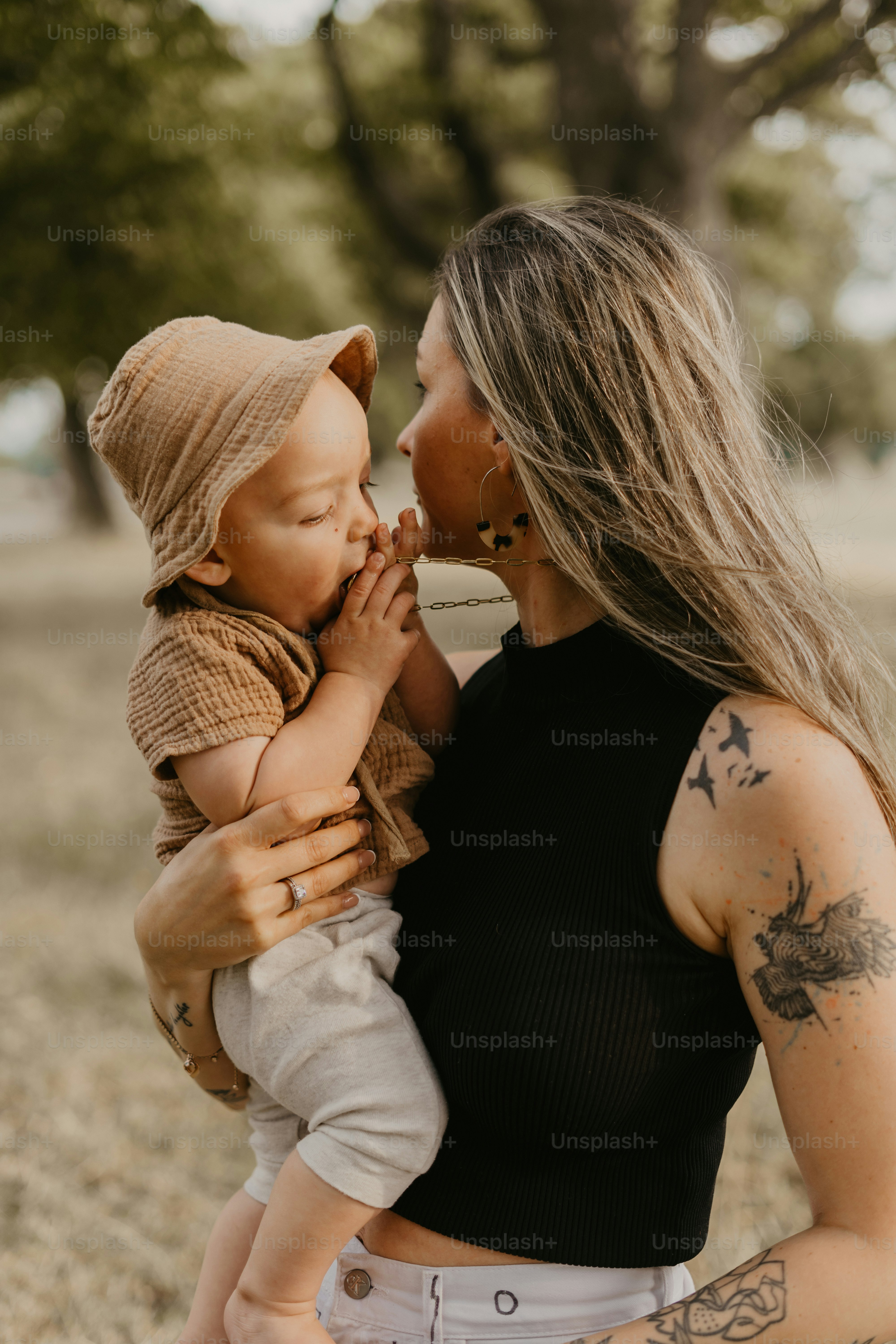 a woman holding a baby in her arms