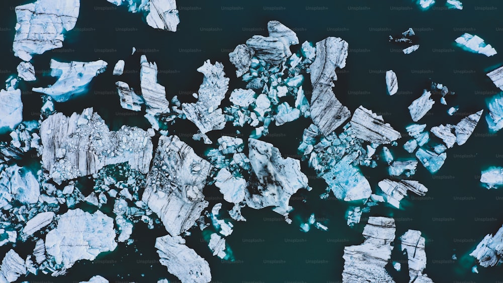 an aerial view of ice chunks in the water