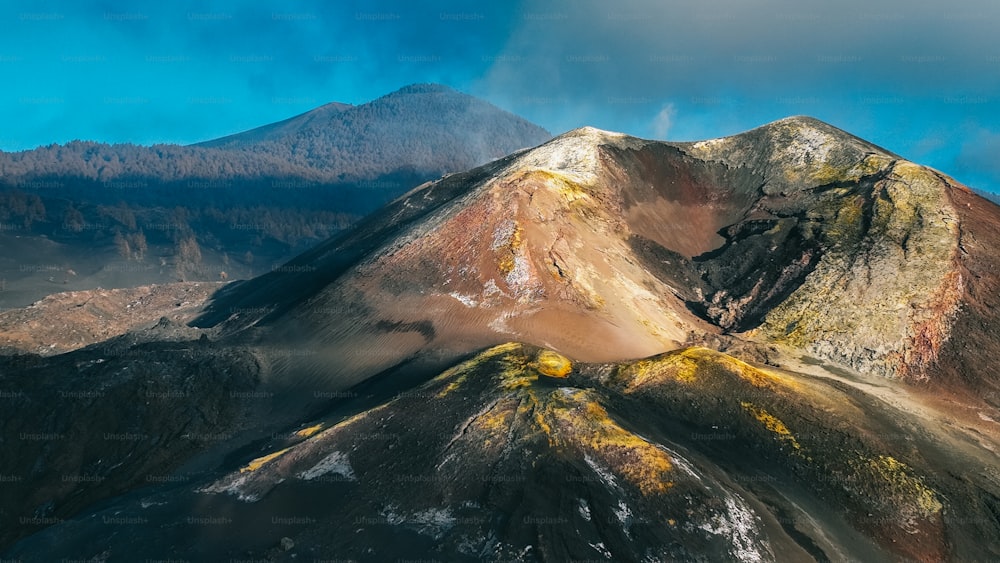 a mountain covered in yellow and brown dirt
