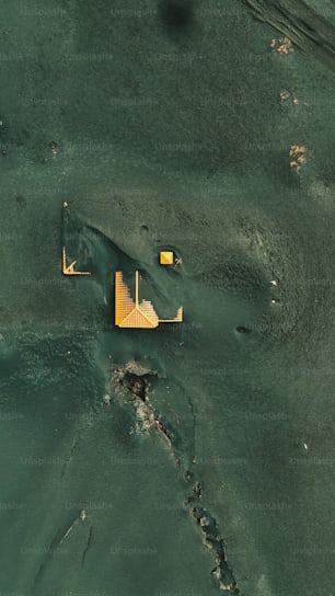 an aerial view of a building in the water