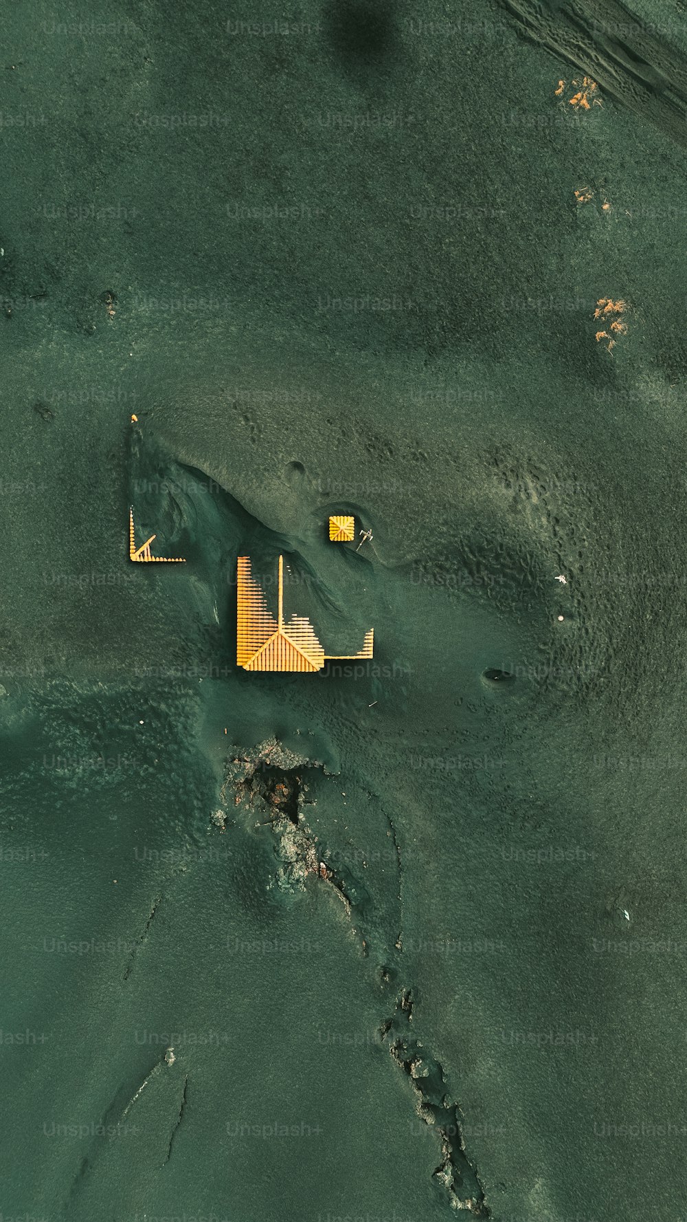 an aerial view of a building in the water