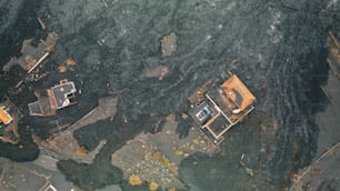 an aerial view of a house on the water