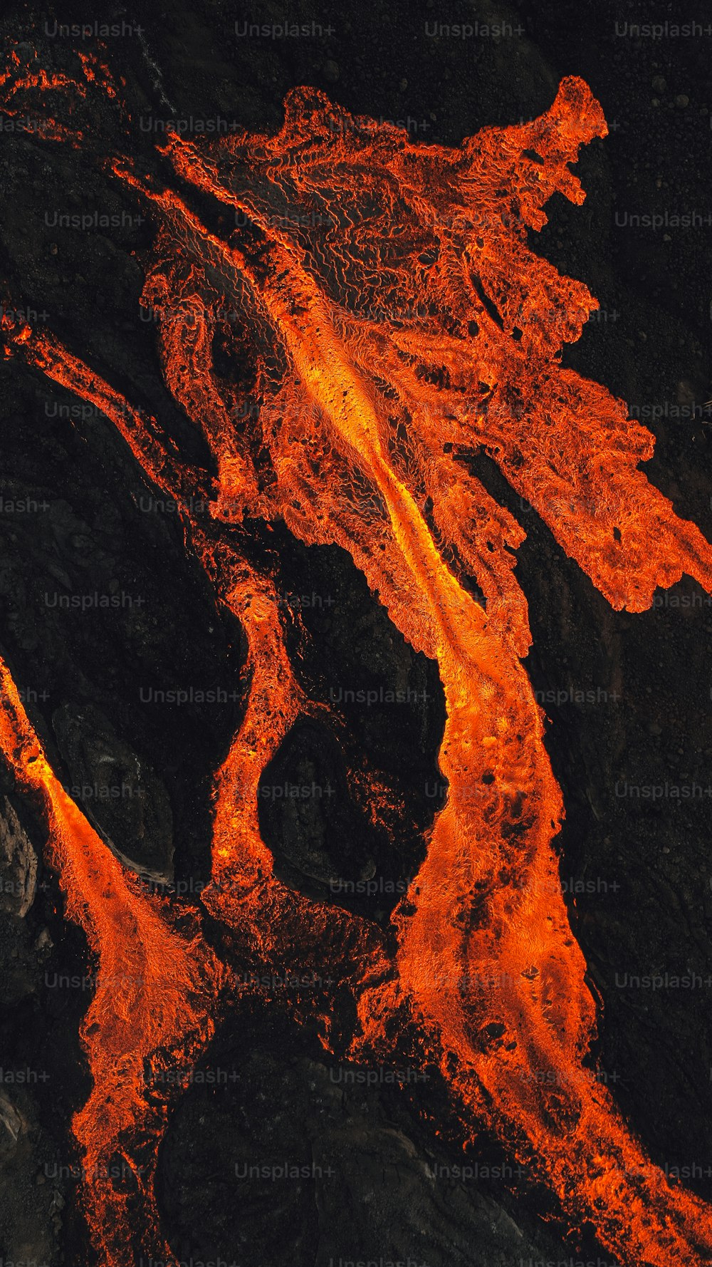 an aerial view of a lava flow in the ocean