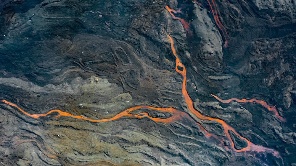 an aerial view of a river in the mountains
