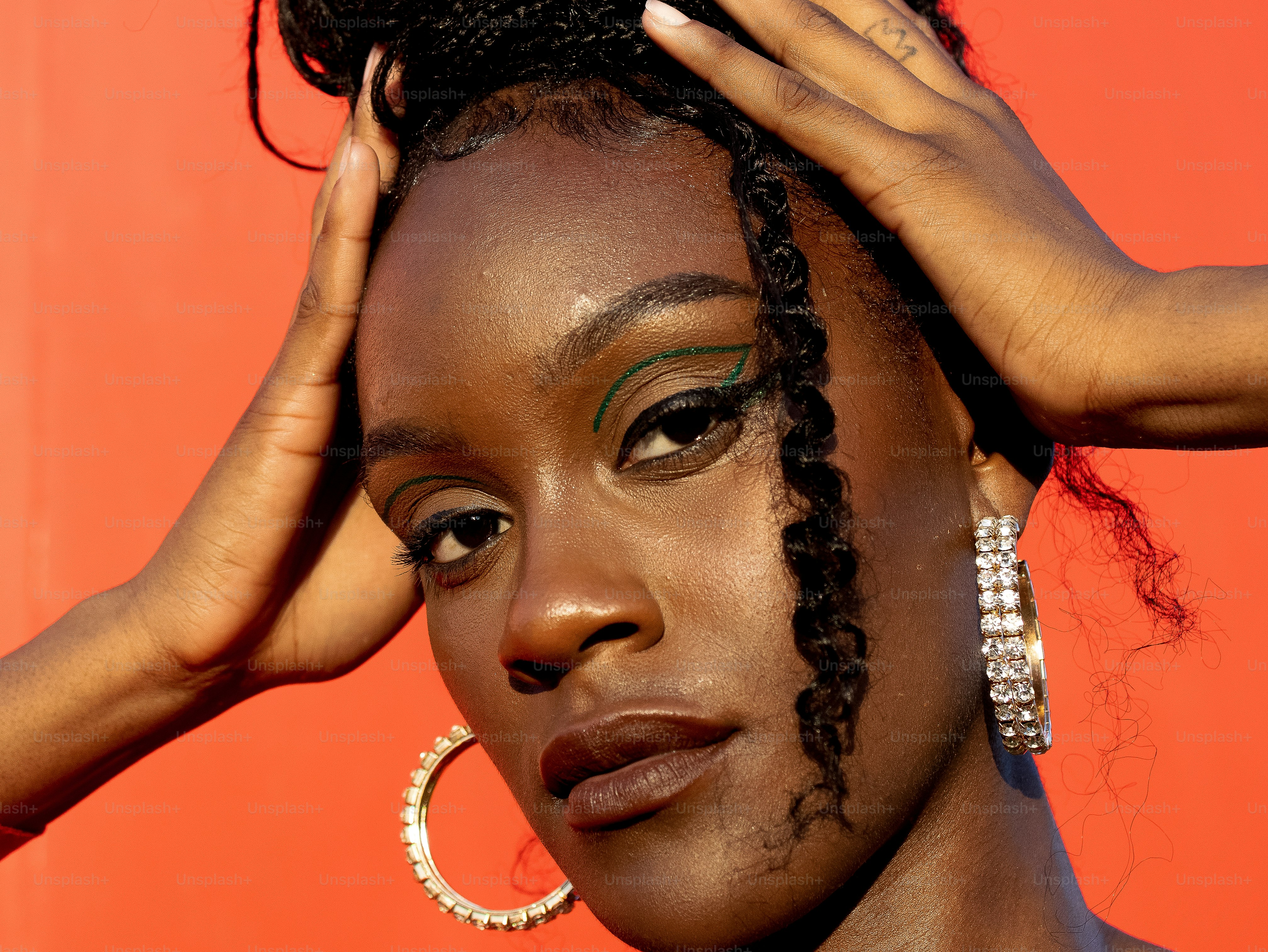 a woman with her hands on her head