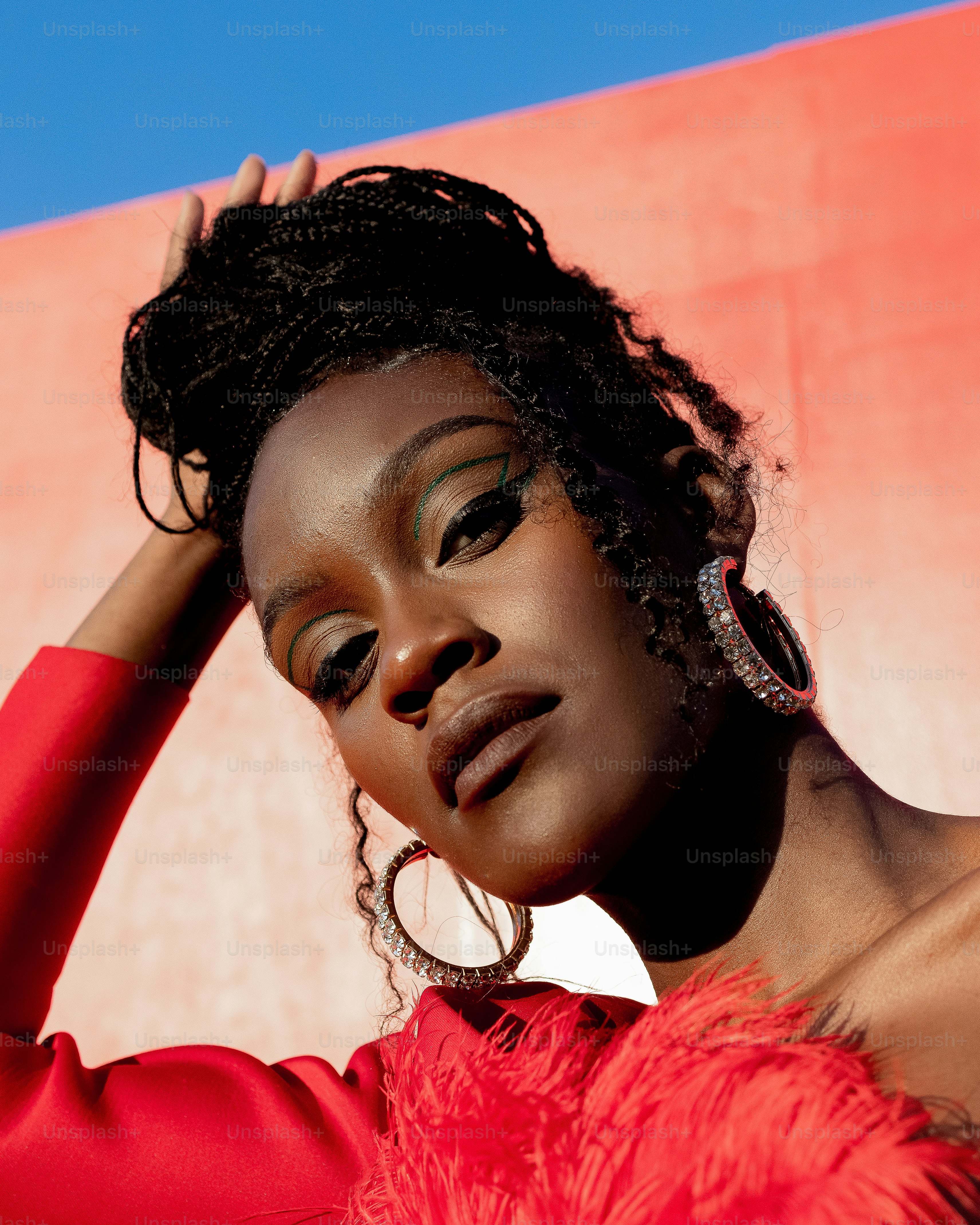a woman in a red dress posing for a picture