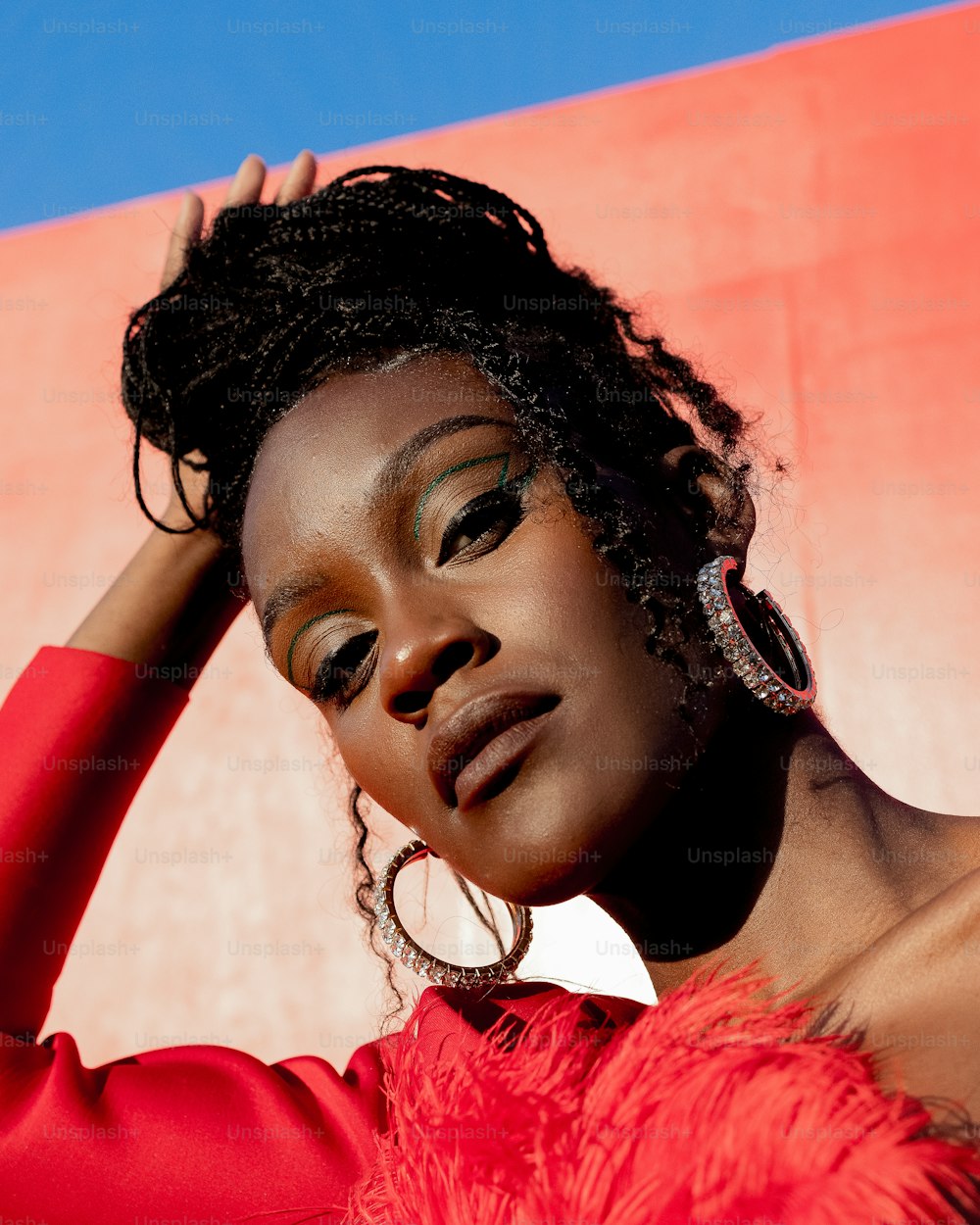 a woman in a red dress posing for a picture