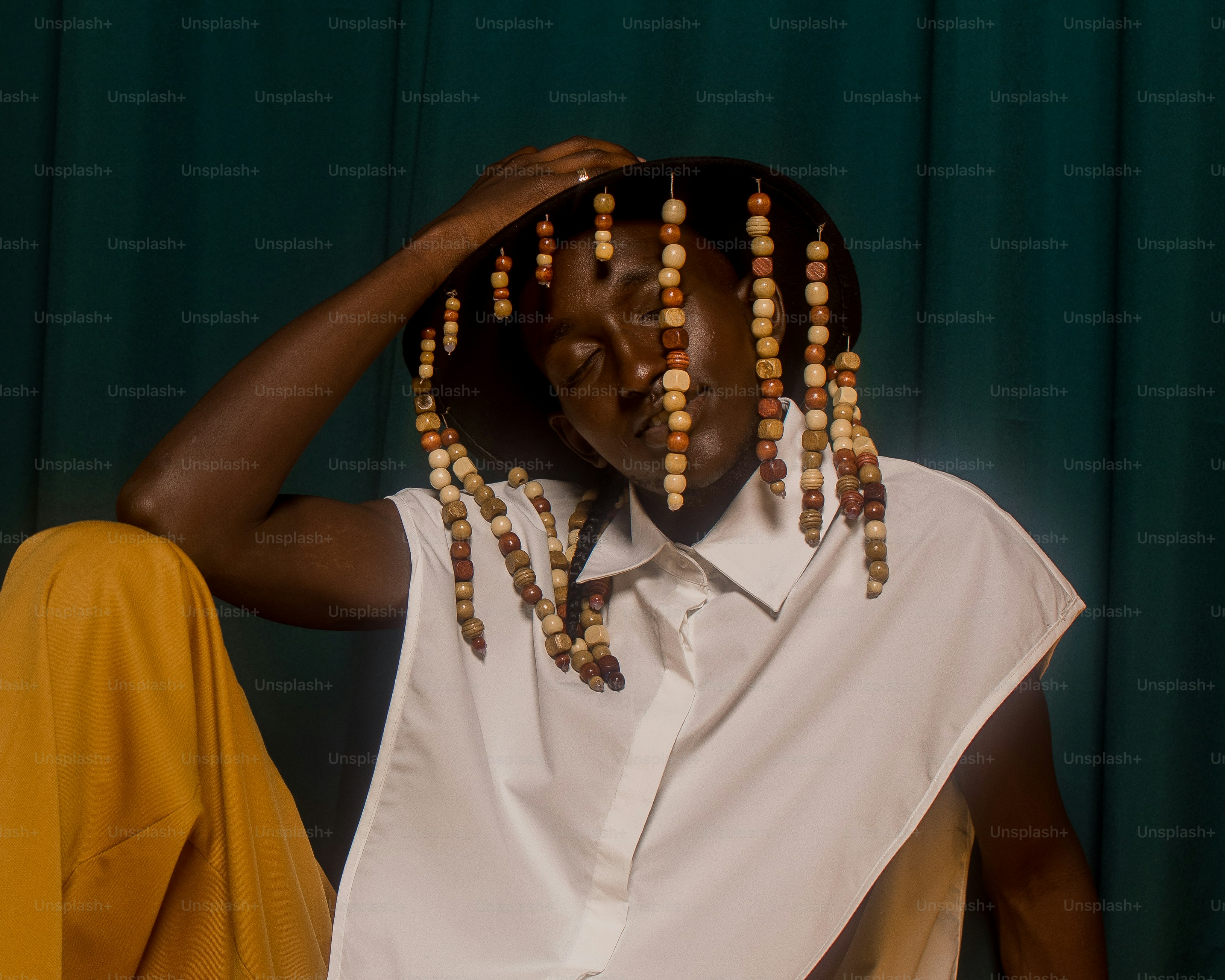 a woman wearing a white shirt and yellow pants