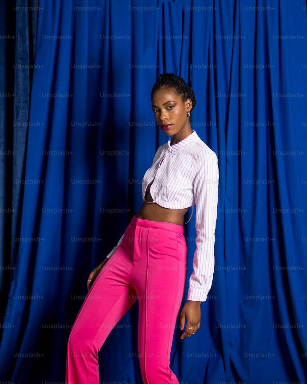 a woman in a white shirt and pink pants