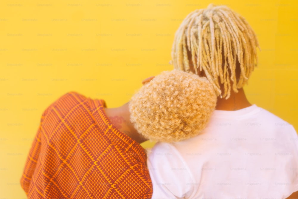 the back of a woman's head with dreadlocks