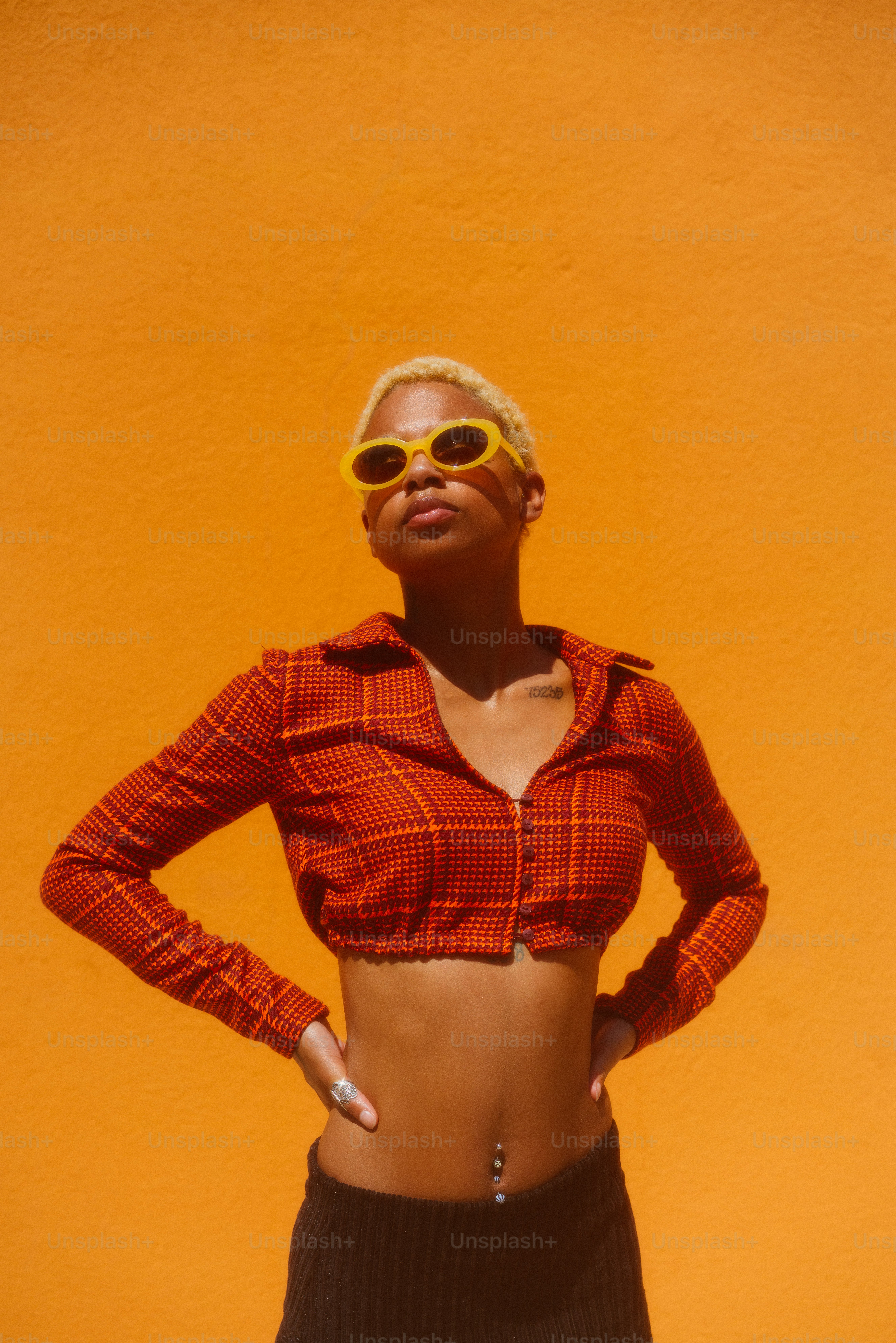 A woman in a red shirt and black skirt photo – Fashion Image on Unsplash