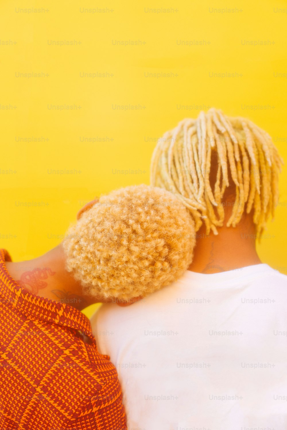 a couple of people with dreadlocks standing next to each other