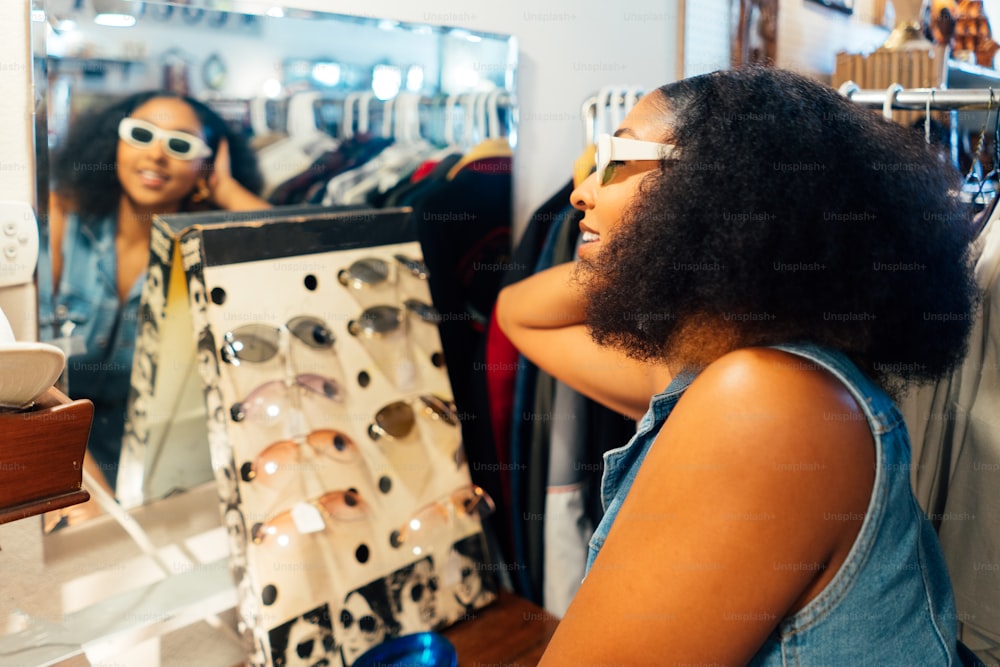 a woman looking at her reflection in a mirror