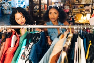 two women looking at clothes in a store