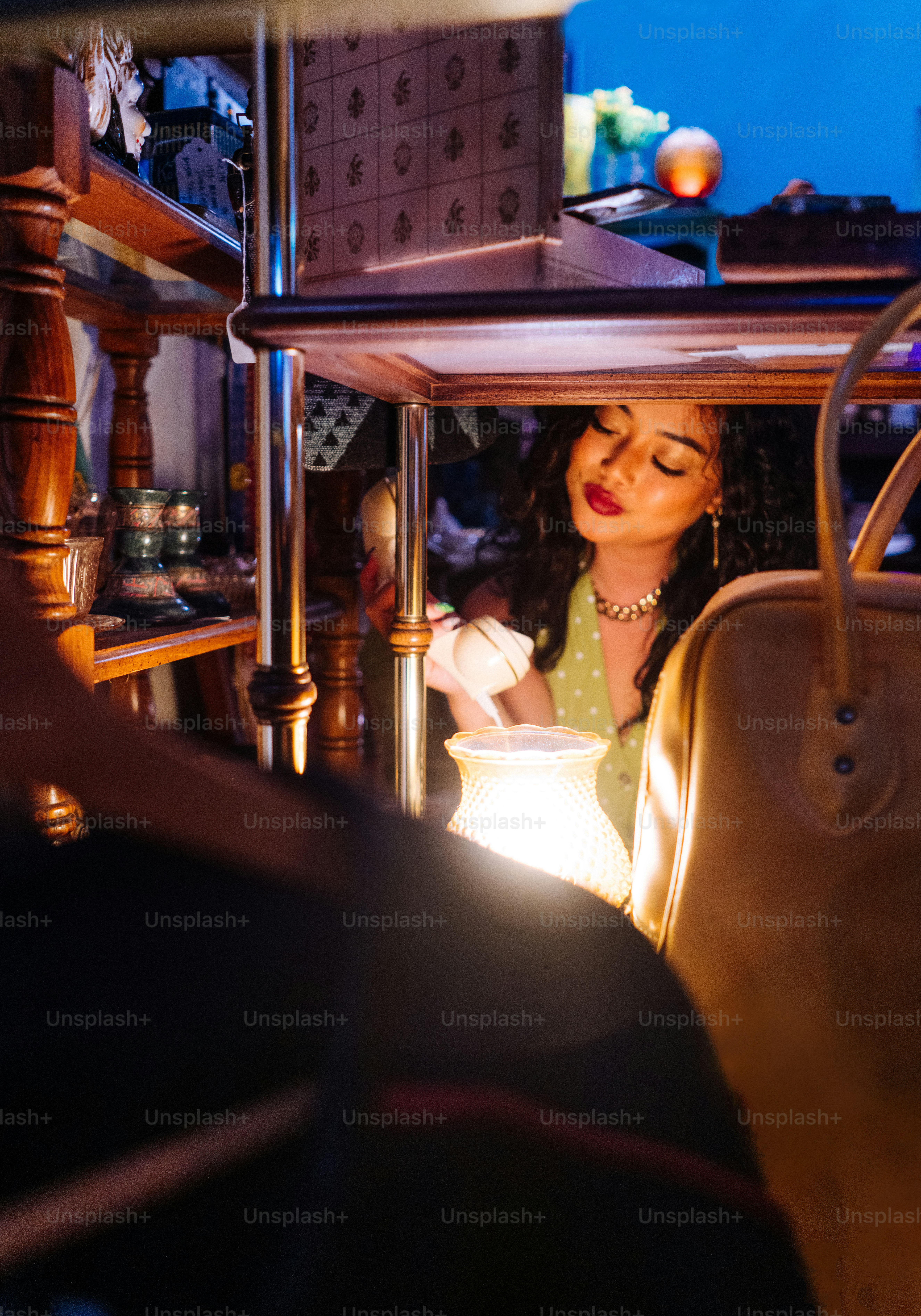 a woman sitting in a chair looking at something
