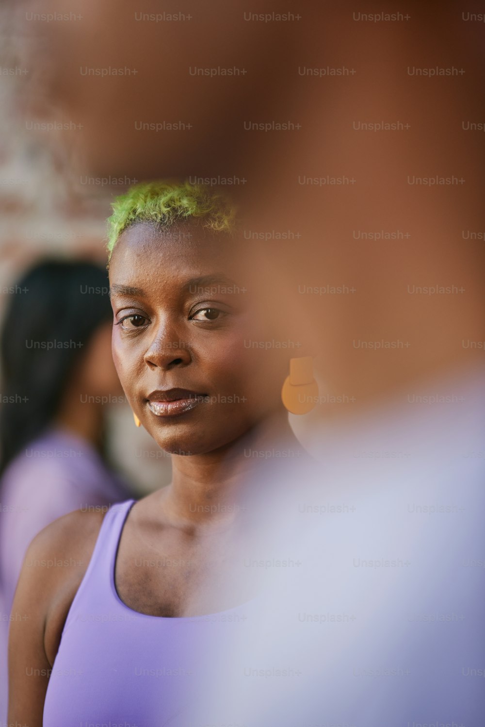 a close up of a person with green hair