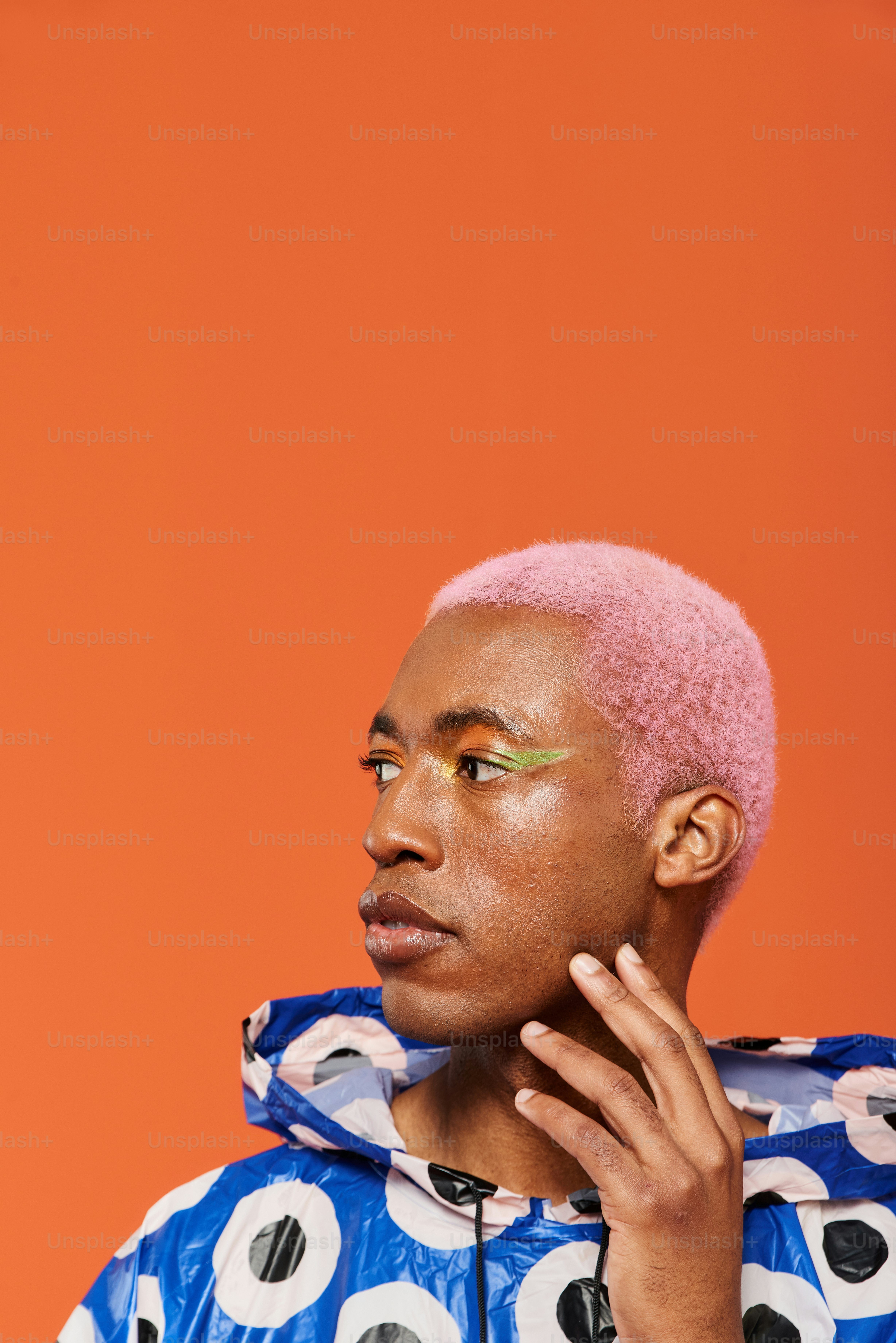 a person with a pink hair and a blue jacket