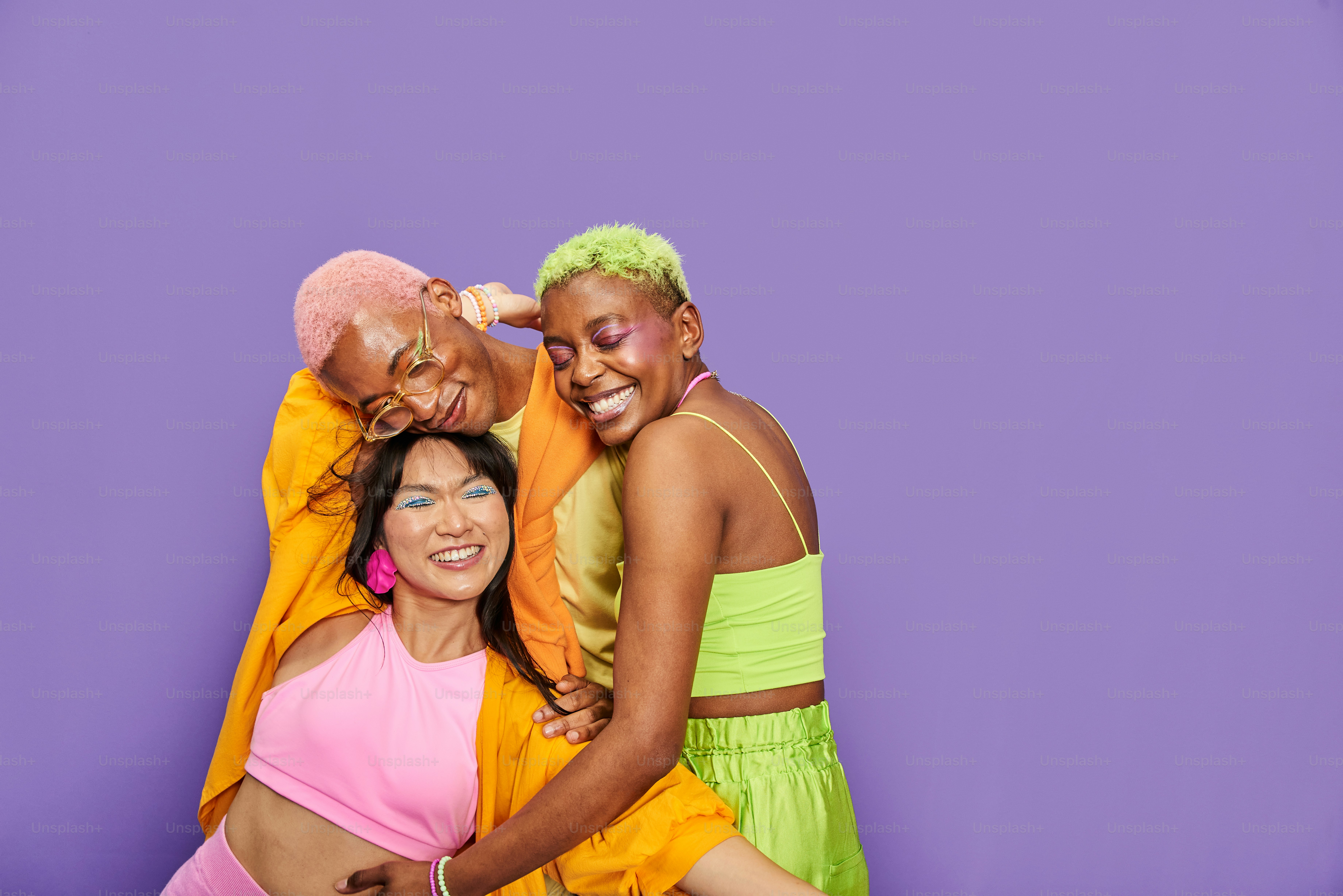 a group of three women standing next to each other