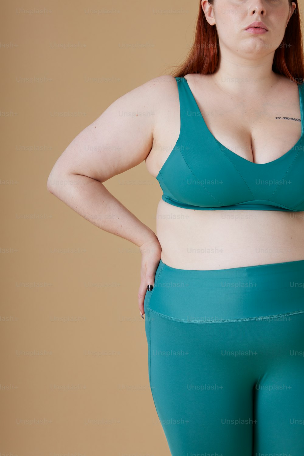 a woman in a green bra top and matching pants