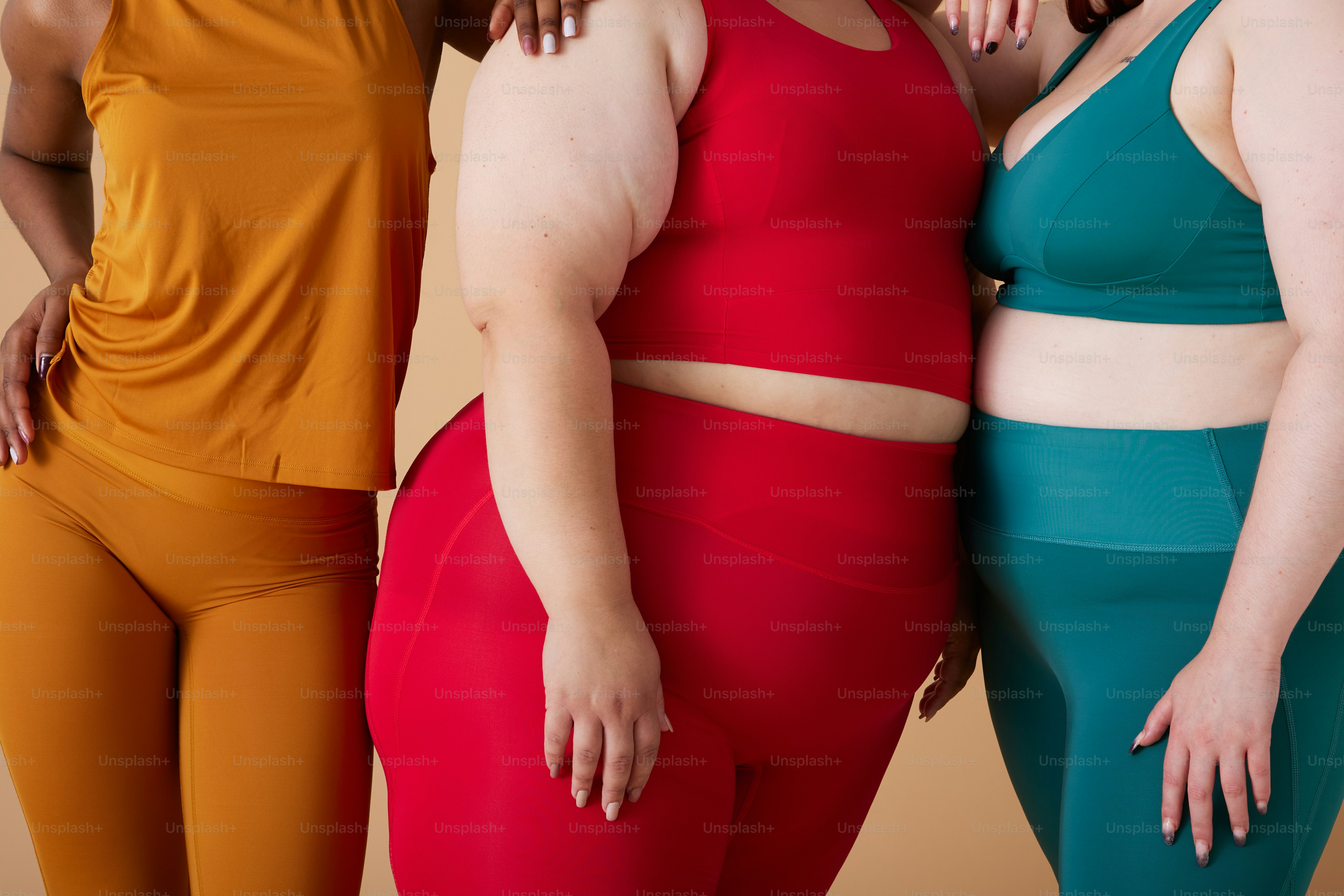 a group of three women standing next to each other
