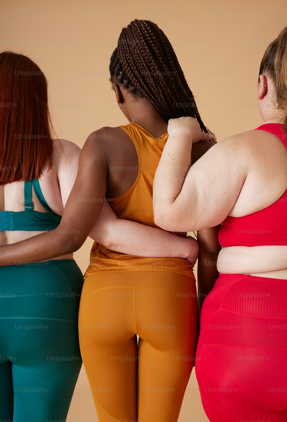 Premium Photo  Two women wearing activewear holding yoga mats standing in  sport studio