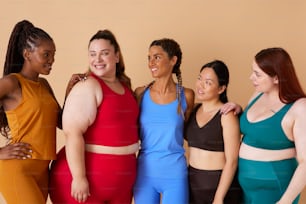 a group of women standing next to each other