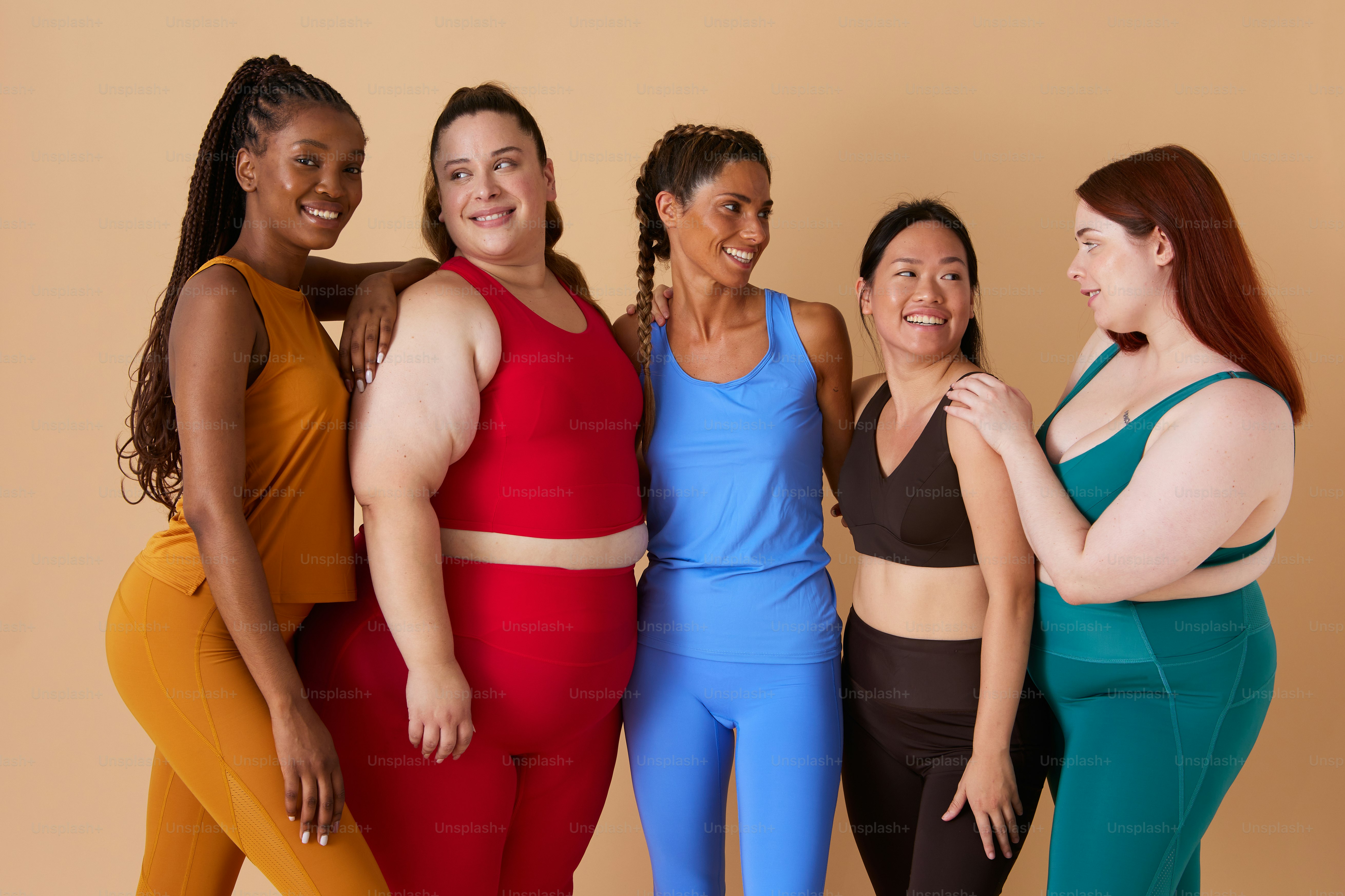 a group of women standing next to each other