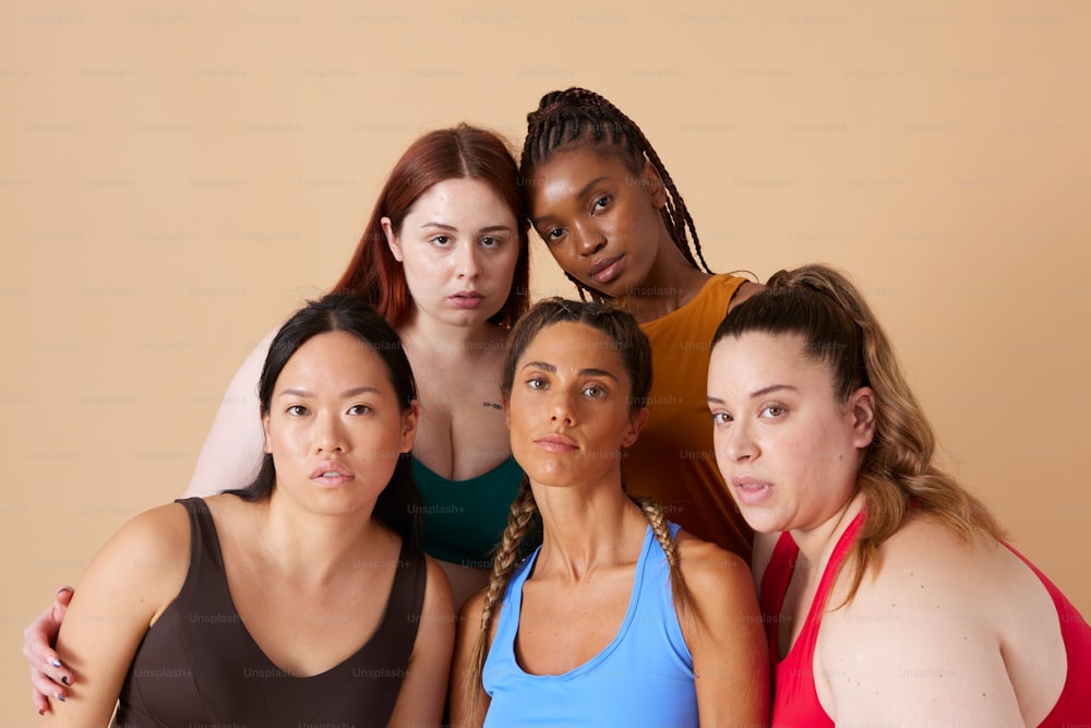 A group of women standing next to each other photo – Spandex Image on  Unsplash