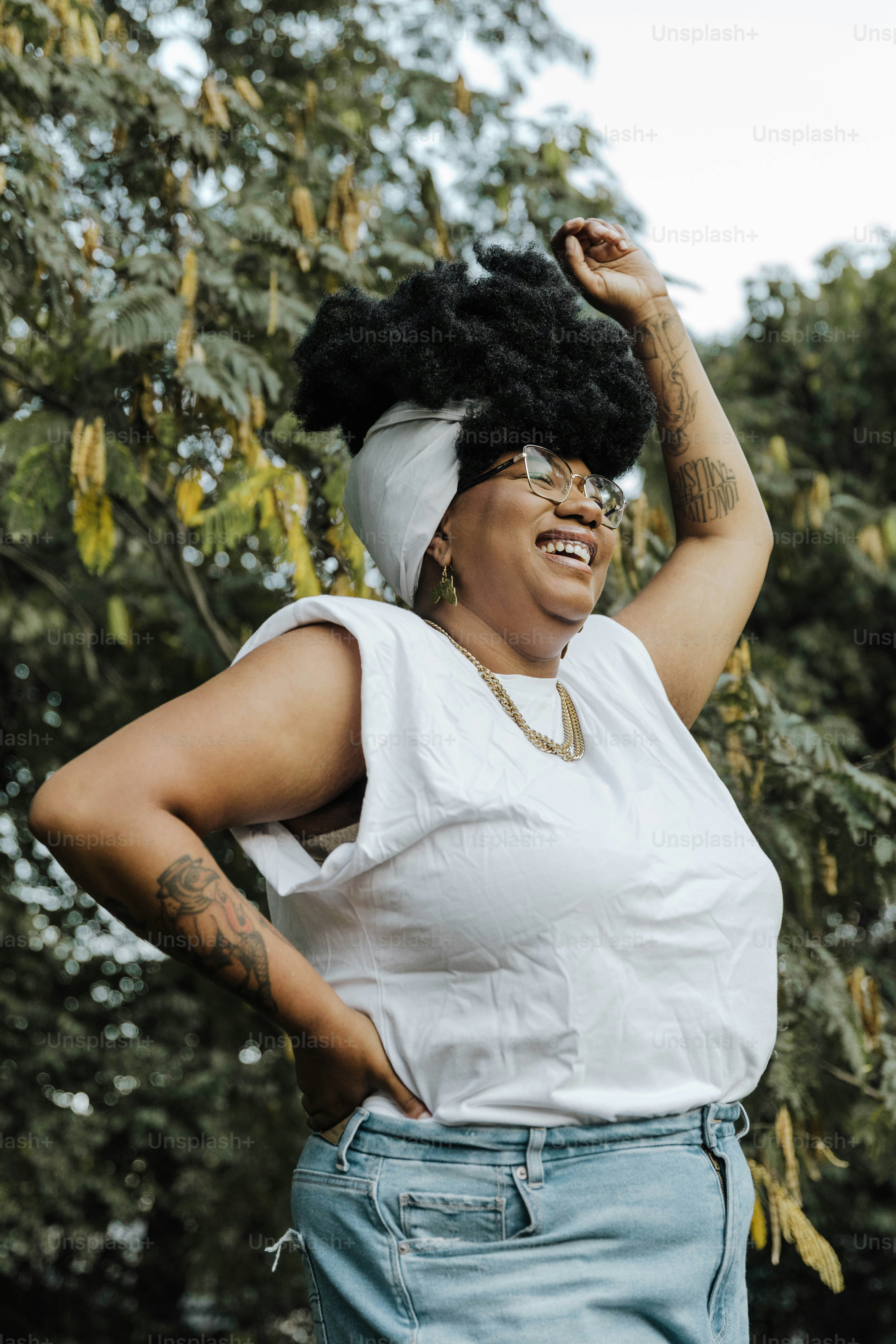 a woman in a white shirt and blue jeans