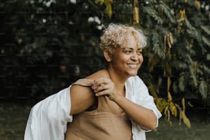 a woman with blonde hair and a white shirt