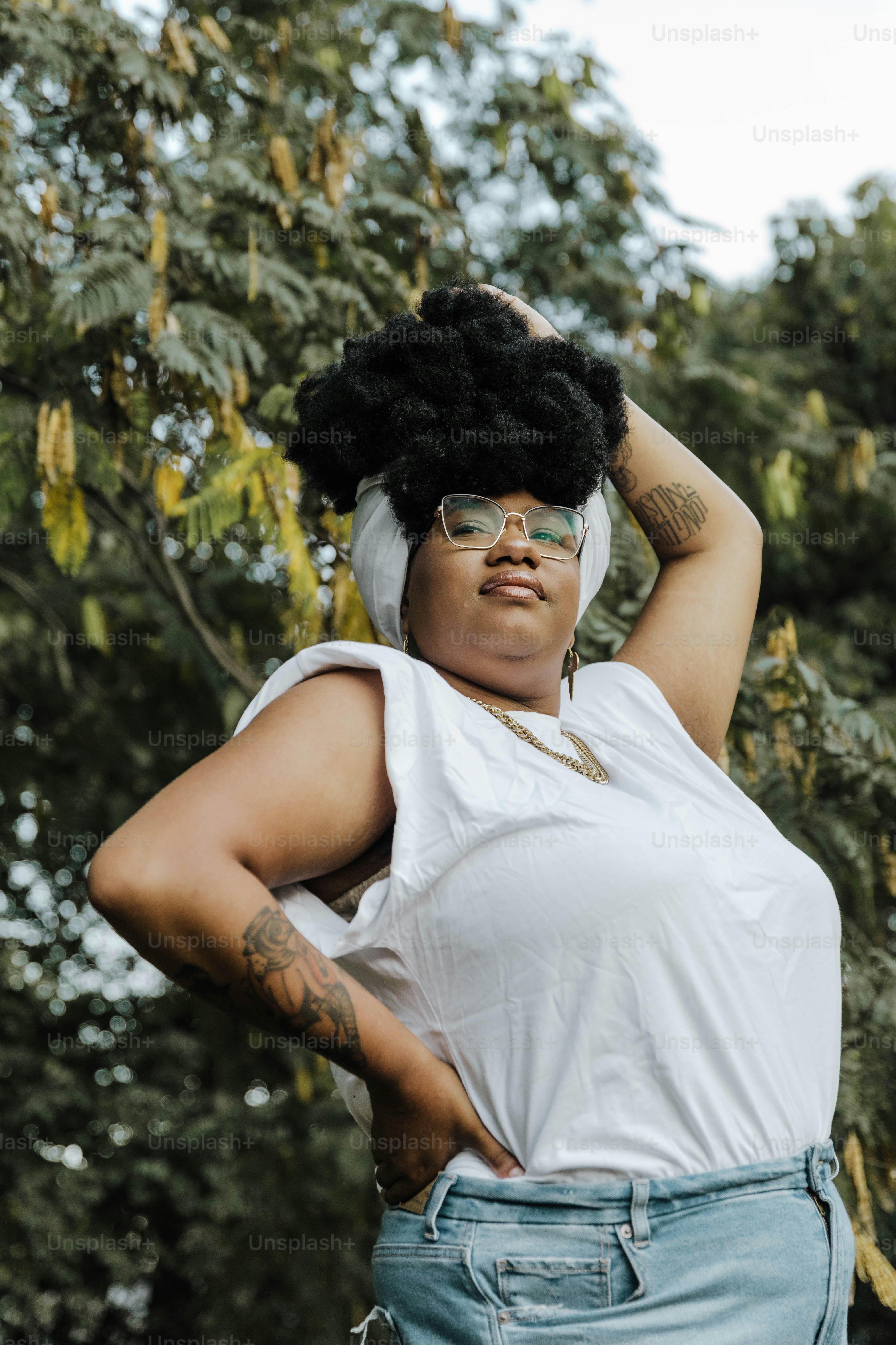 a woman wearing a white shirt and blue jeans