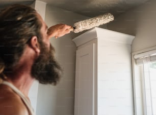 a man with a beard is holding a brush