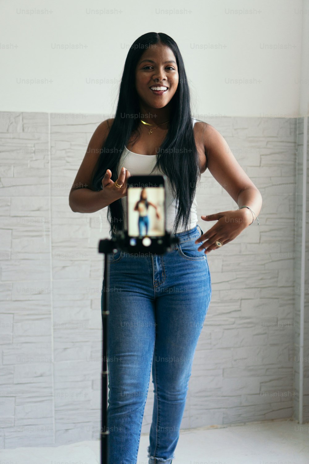 African Woman Filming Herself Dancing Using Smartphone