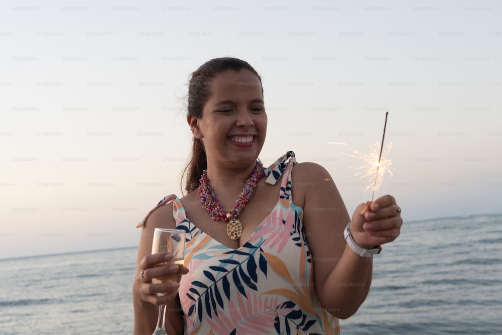 Woman Celebrating With Sparkles. New Year's Eve Celebration Concept