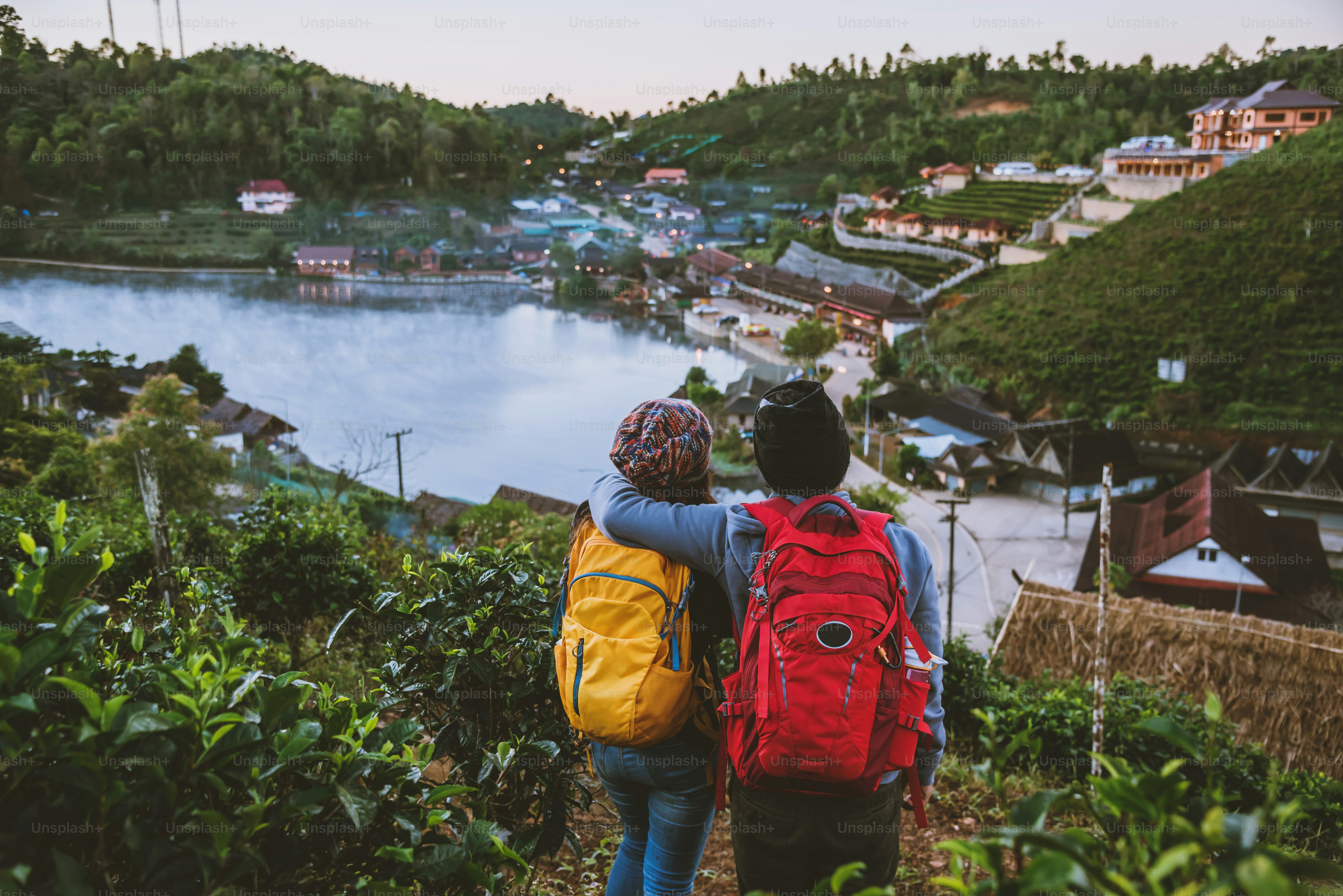 Couple family traveling together on mountain in village countryside on Thailand, at Ban Rak Thai village. Travel relax holiday.