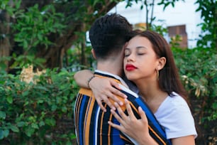 Young couple hugging in the park