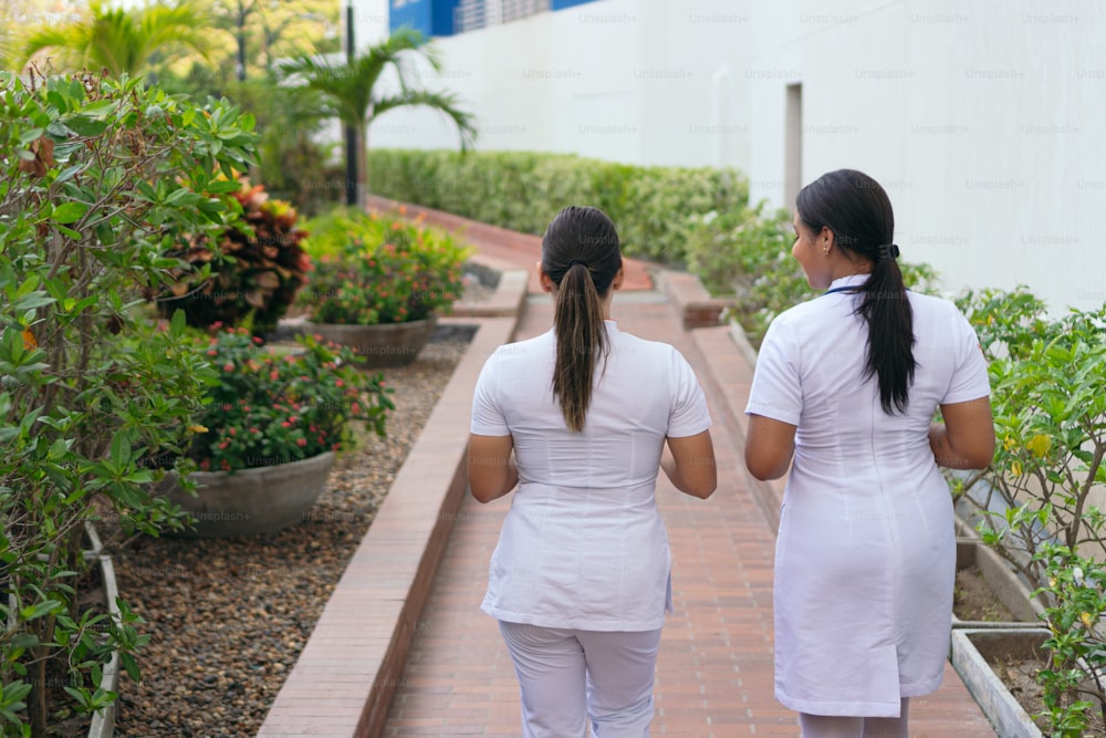 Two physicians walking to their office