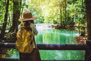 The girl travel take a photo of the Than Bok Thorni Waterfall National Park. lake, mangrove forest. travel nature. Travel relax. travel Thailand, backpack, style, forest, summer.