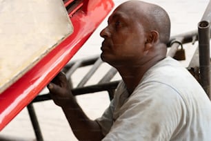 Man Working In A Mechanical Workshop In Latin American