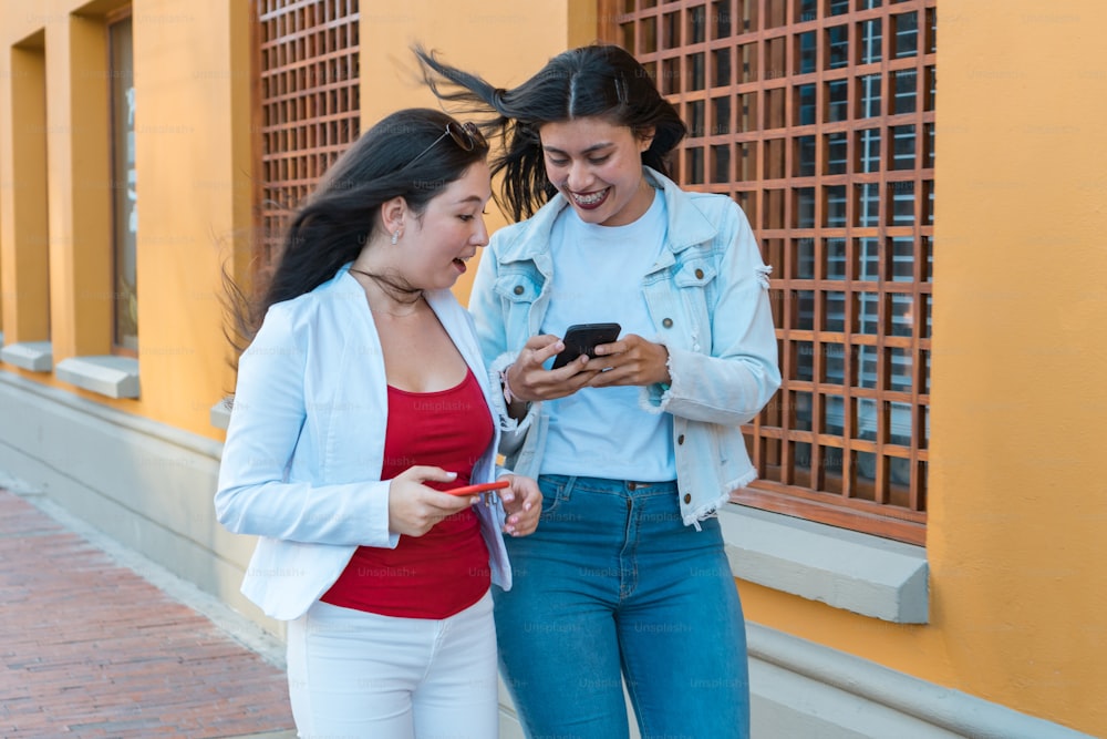 Cheerful Young Women Walking On Street