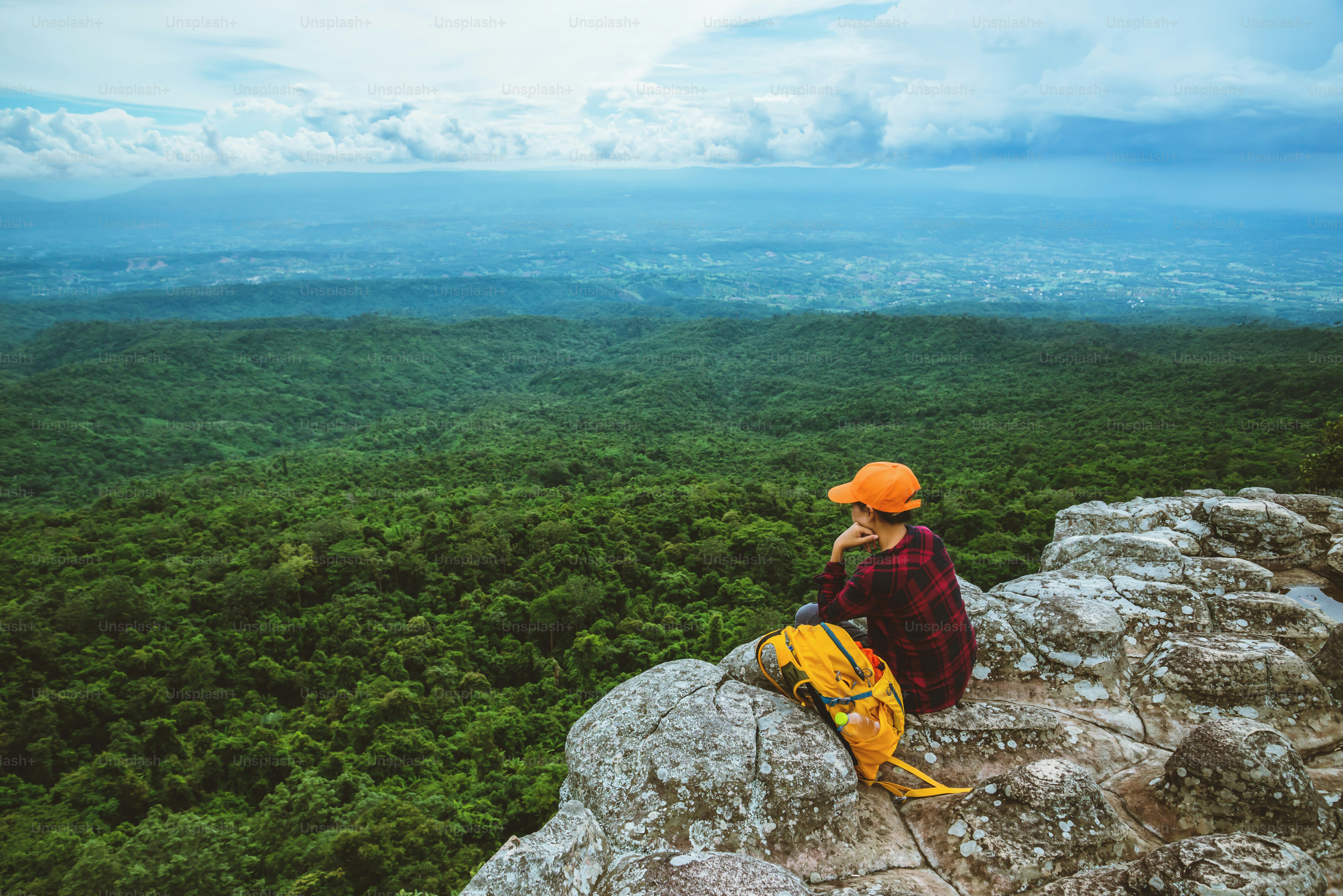 woman asians travel relax in the holiday. View mountain nature on the cliffs.